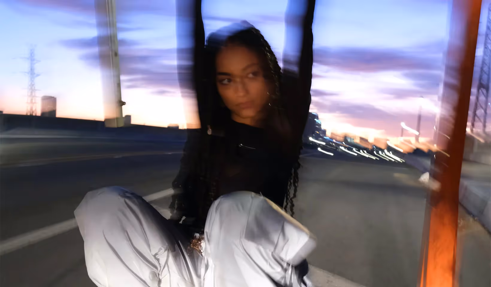Gen Z girl posing on the street, out of focus camera, motion blur