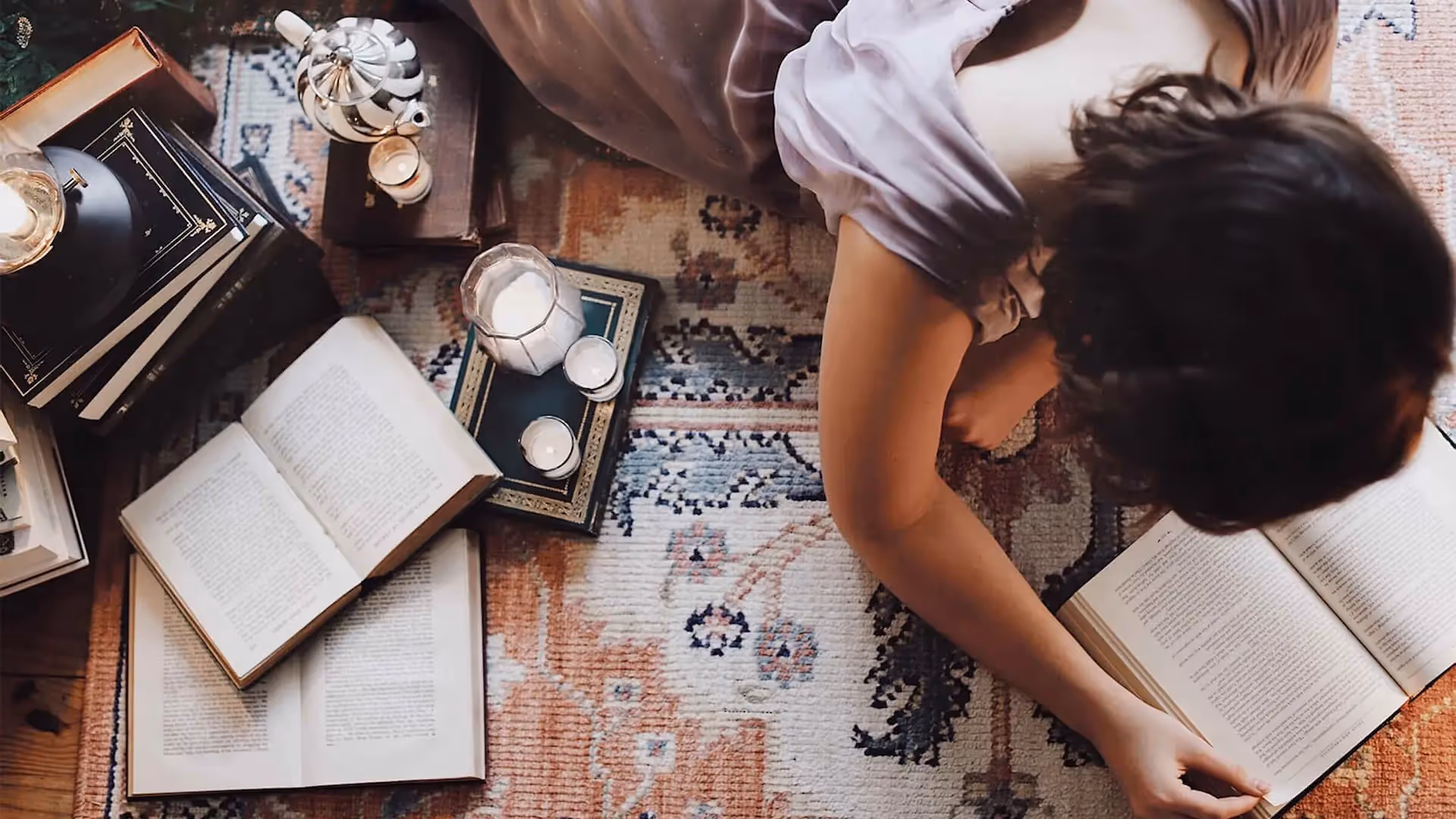 Woman lying on floor journaling social media content