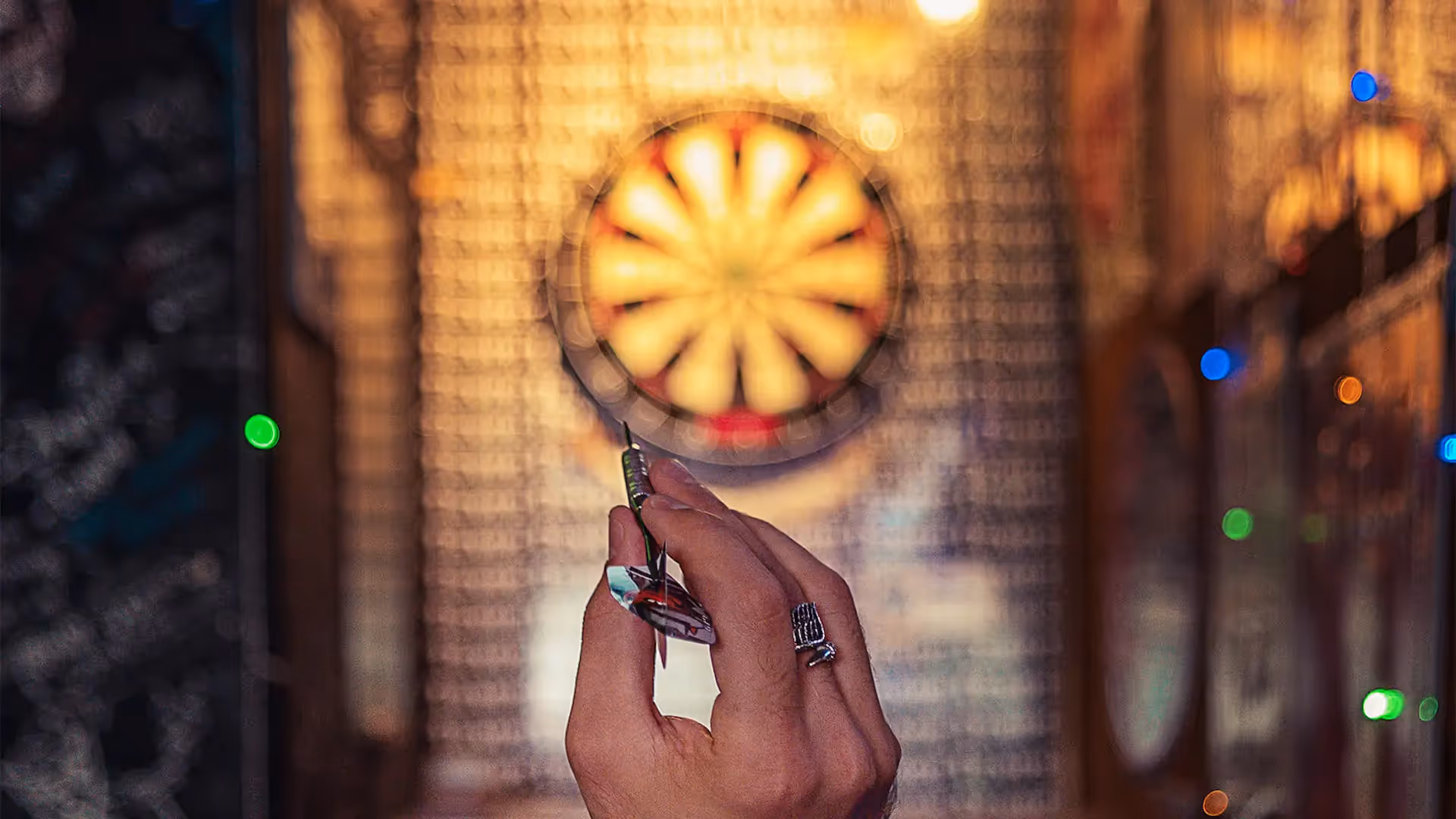 Action POV shot of man throwing dart at board