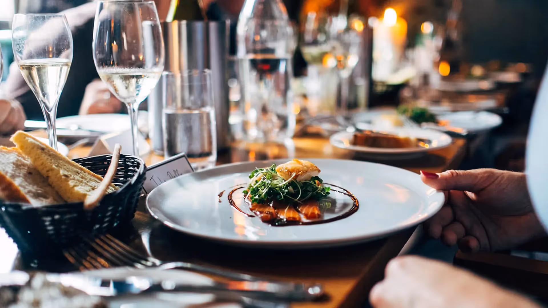 Salmon salad and white wine in fancy restaurant