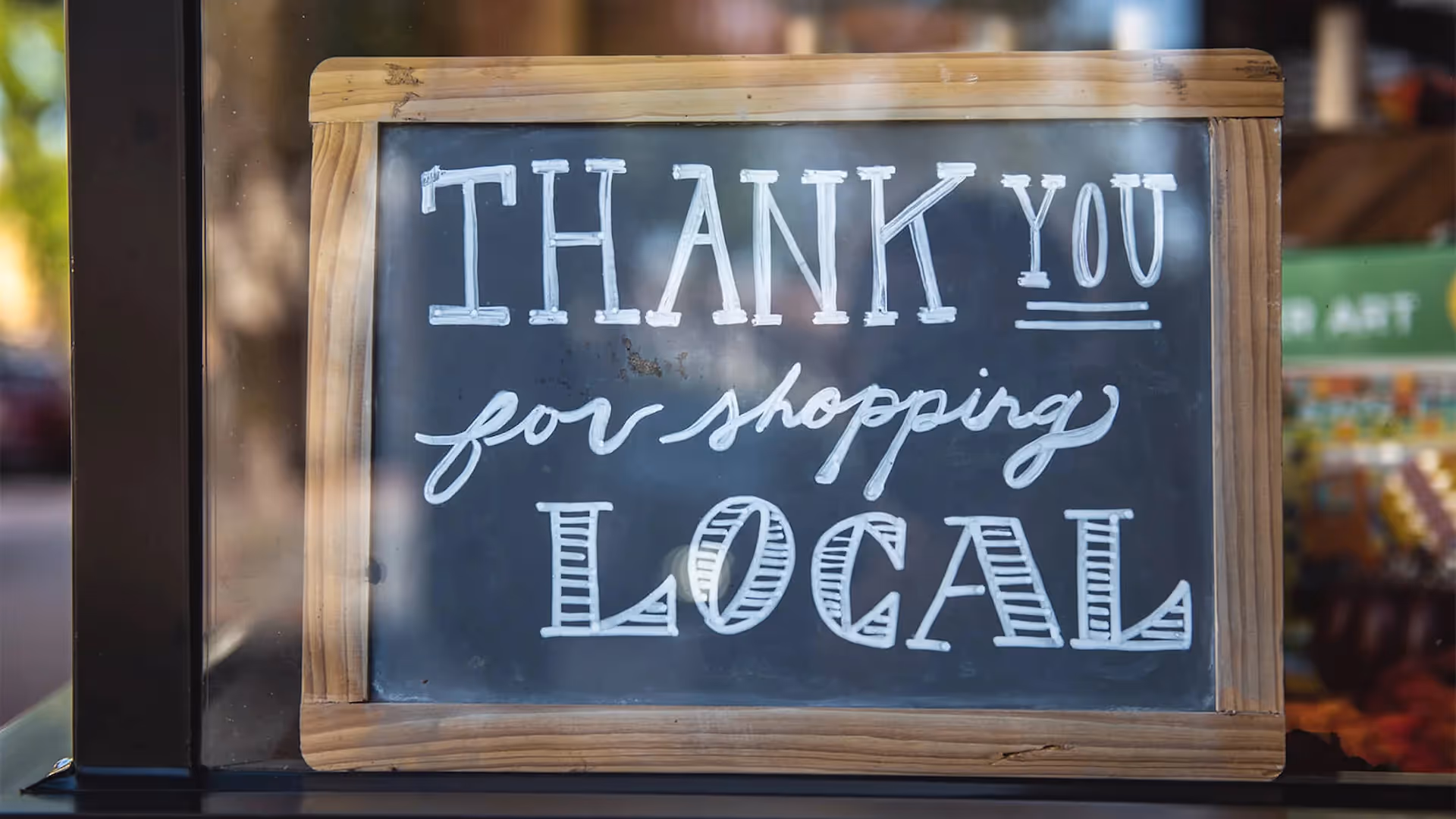 Sign reading "Thank you for shopping local"