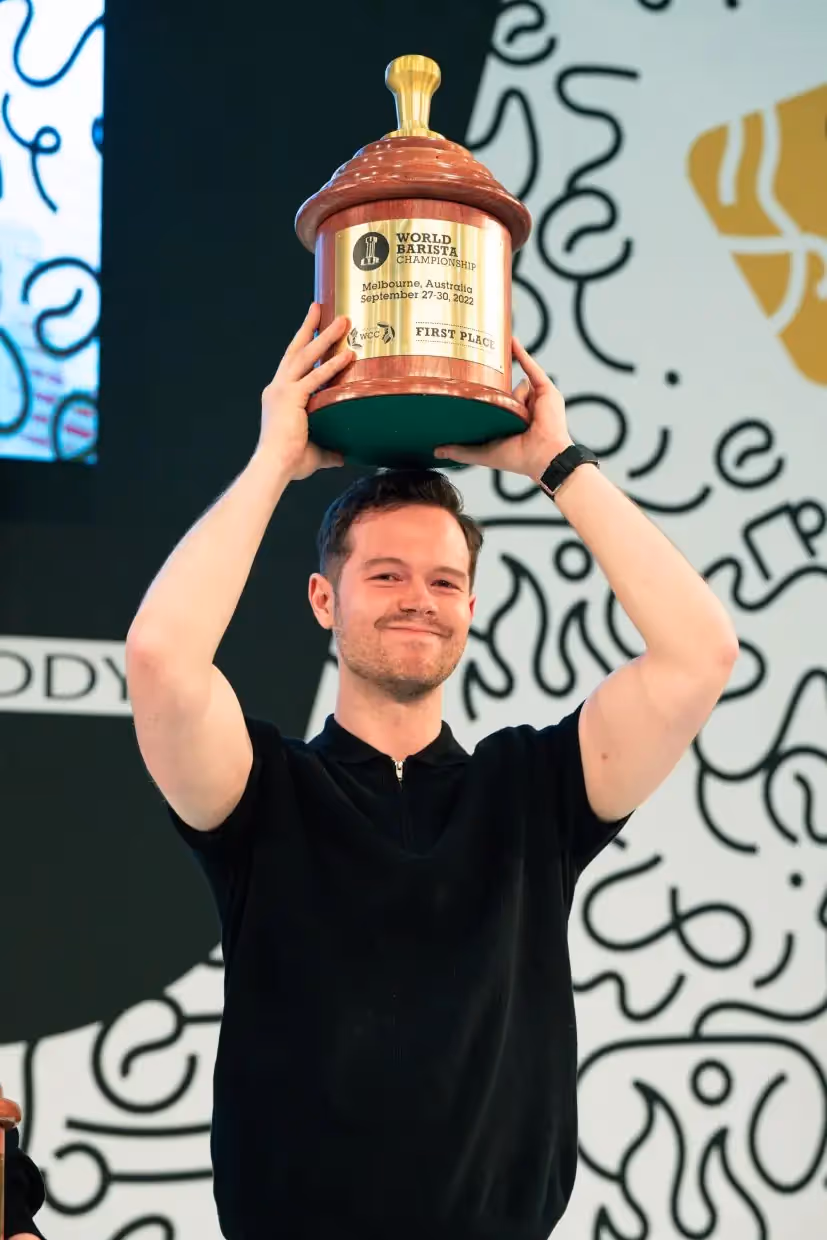 WBC coffee champion Anthony Douglas holding trophy