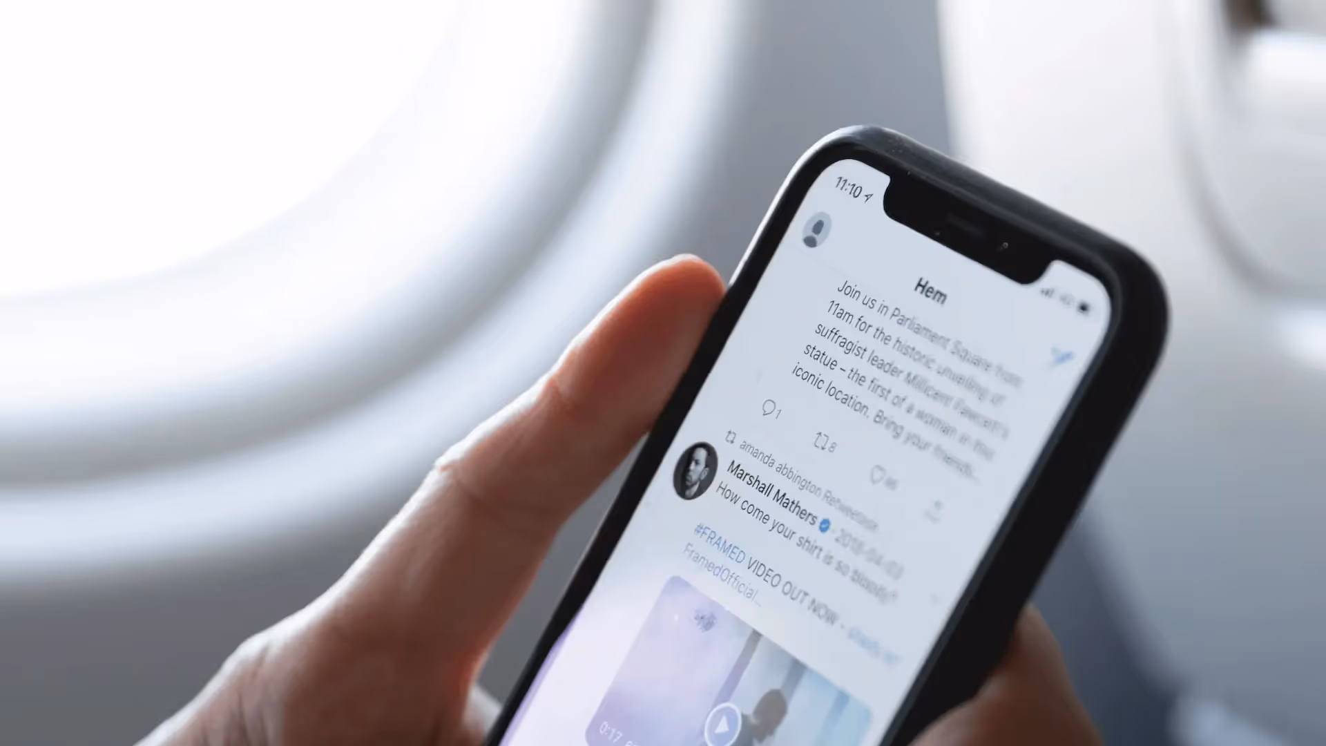 Journalist scrolling Twitter on iPhone