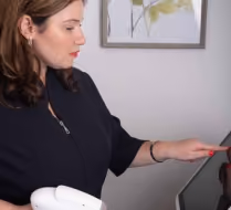 woman turning cosmetic equipment