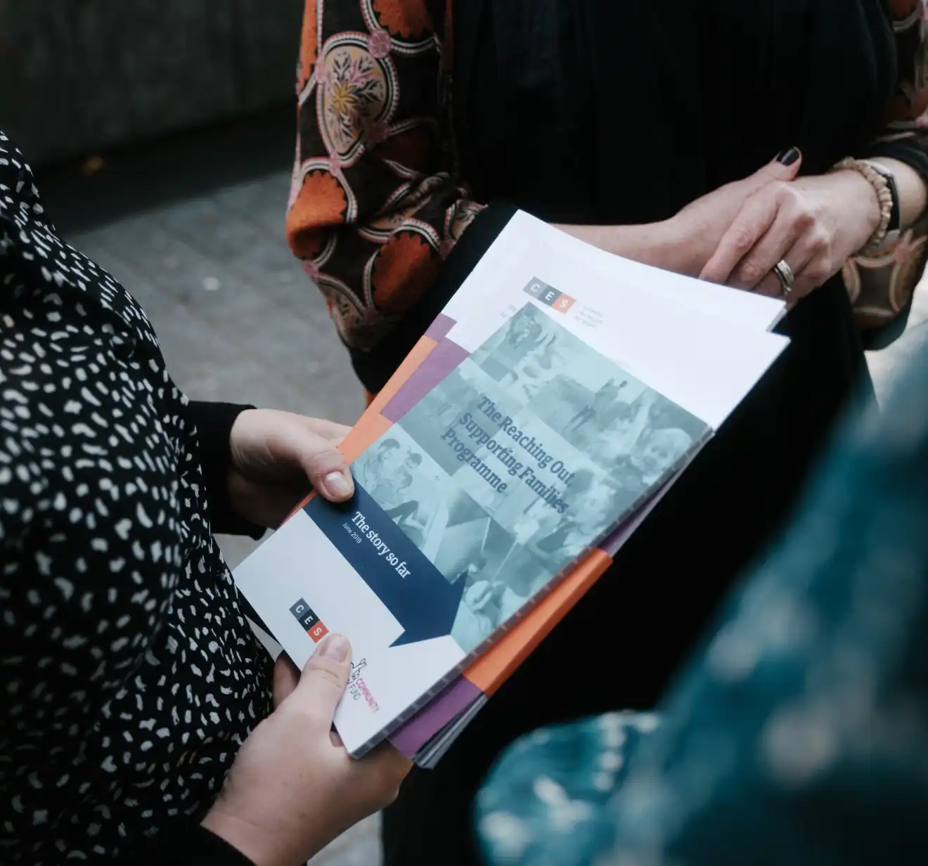 CES Team memebers holding some documents