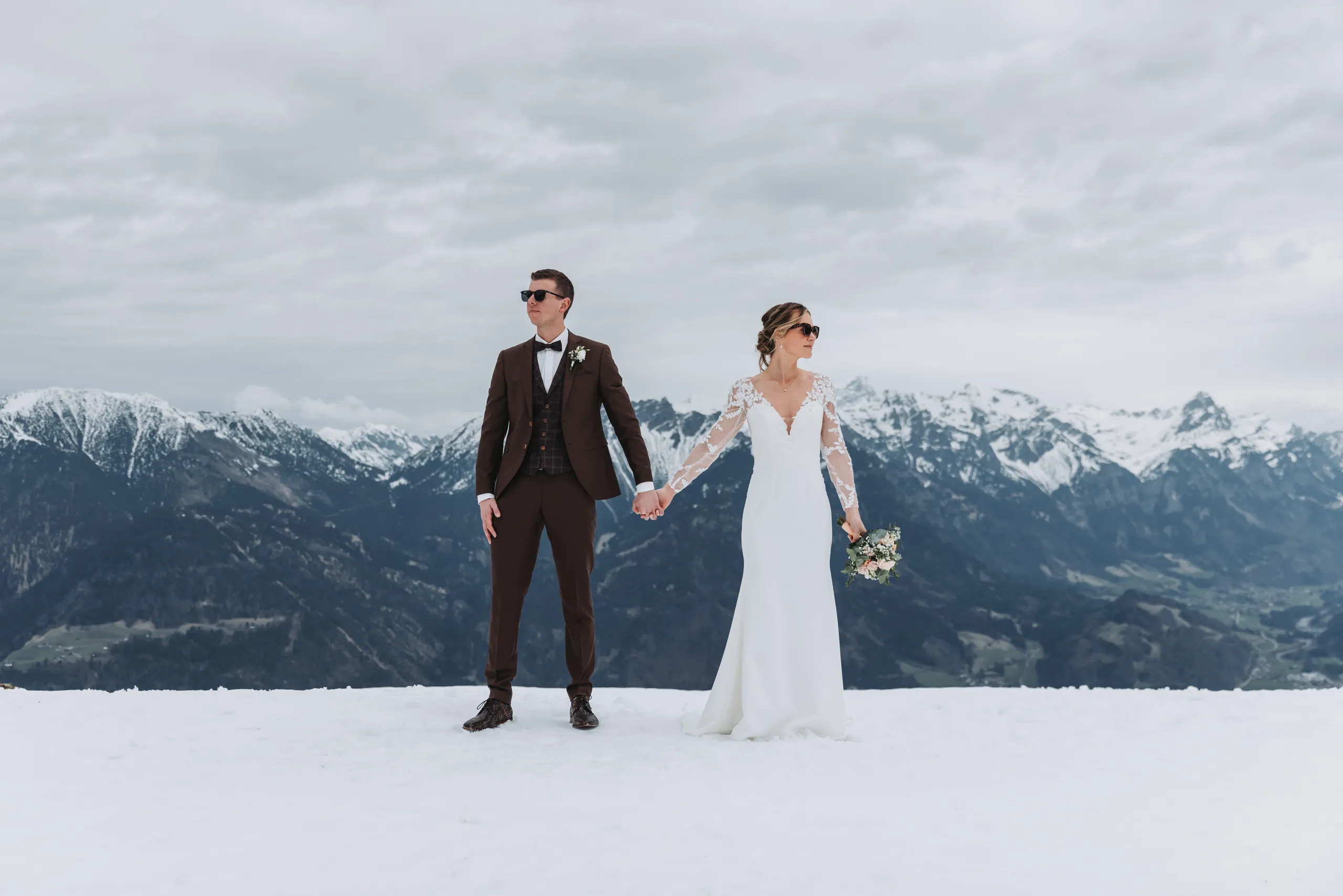 Couple during their couple shoot in the snowy mountains
