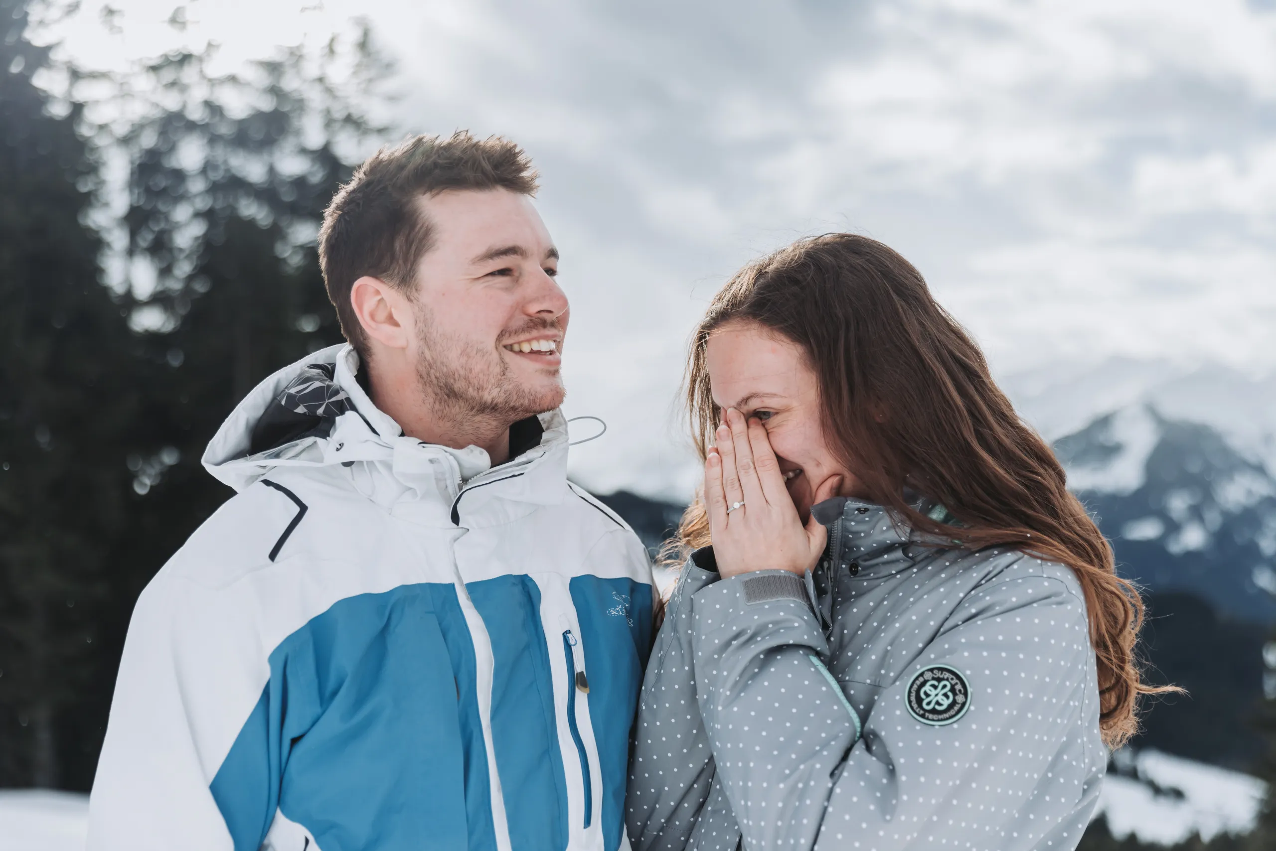 Fiancée and fiancé after getting engaged in the Austrian Alps