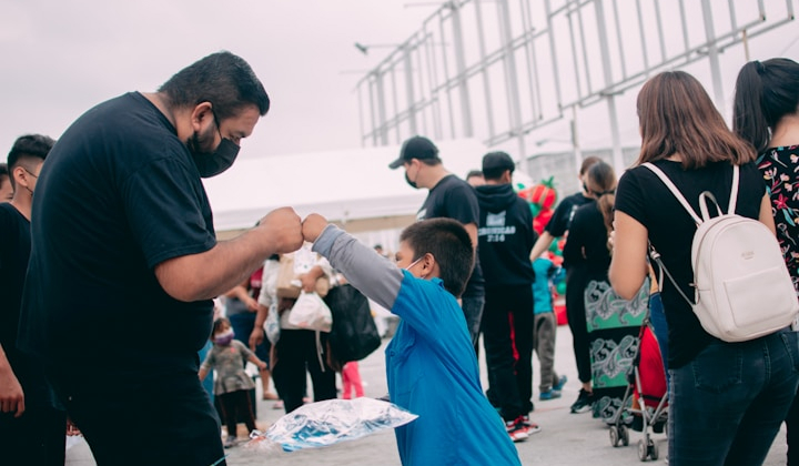 Salesforce Free for Nonprofits – Volunteer Giving Thumbs Up with Child