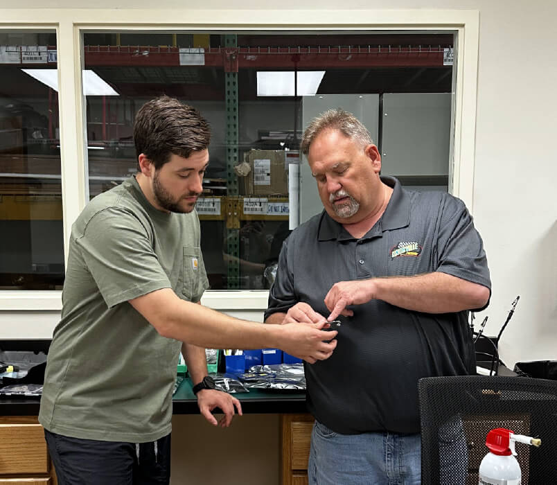 two guys working together in engineering lab