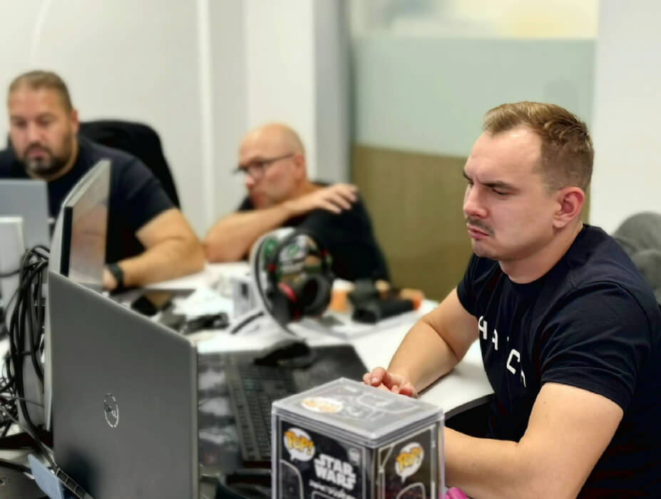 three engineers designing on computers