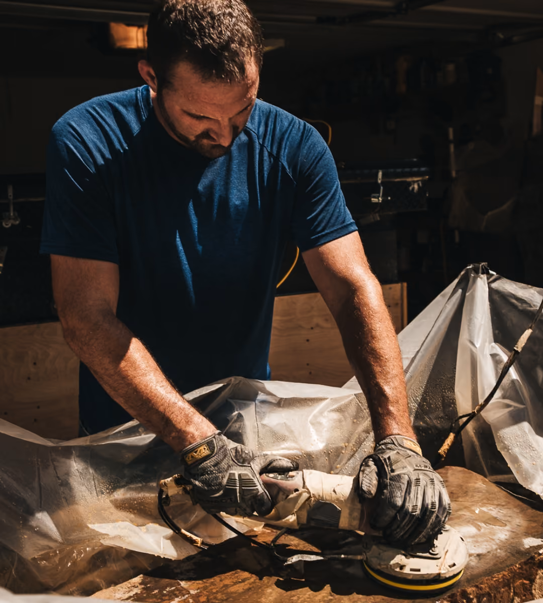 Owner of Griffin Stoneworks making a landscape stone