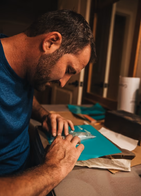 Owner of Griffin Stoneworks designing a stone