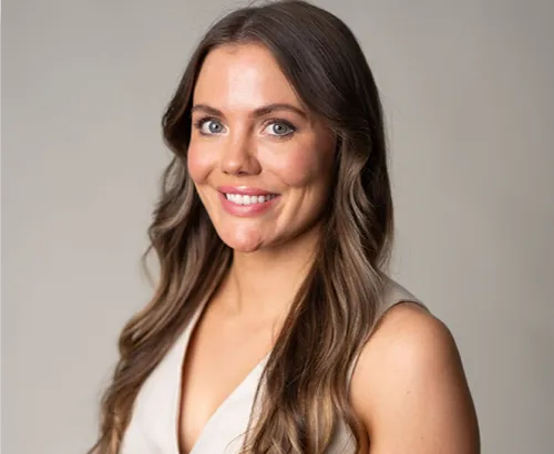 A woman with a smile on her face.