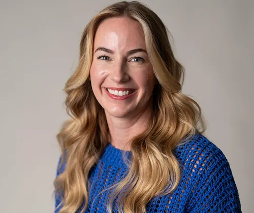 A woman with a smile on her face.