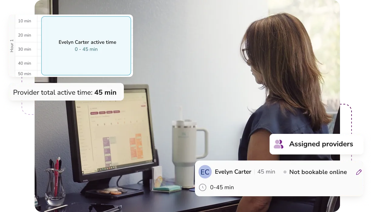 Person sitting at a desk looking at a computer screen showing a scheduling interface with details about Evelyn Carter's 45-minute active time and provider booking status.