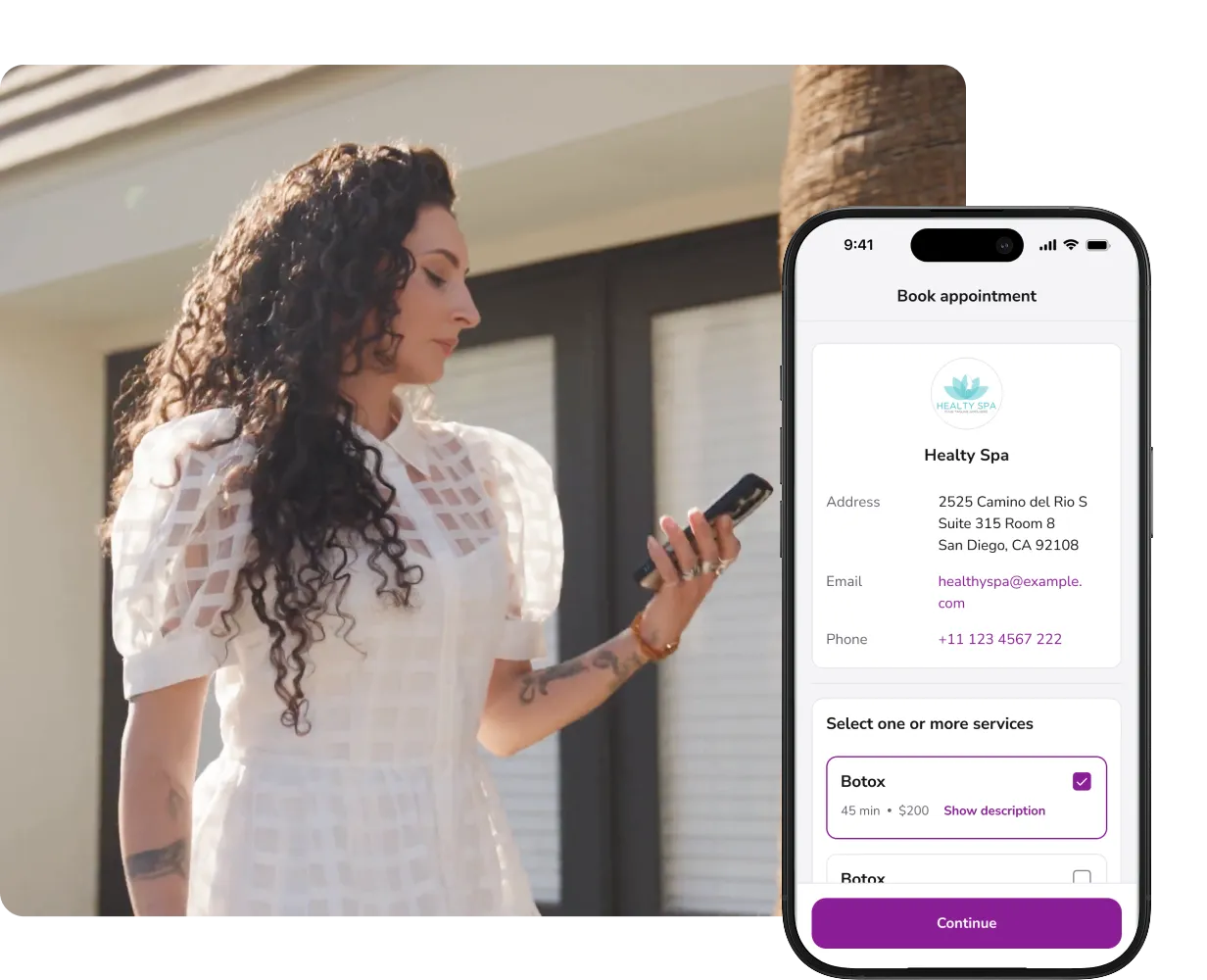 A woman sitting at a desk using a laptop computer.