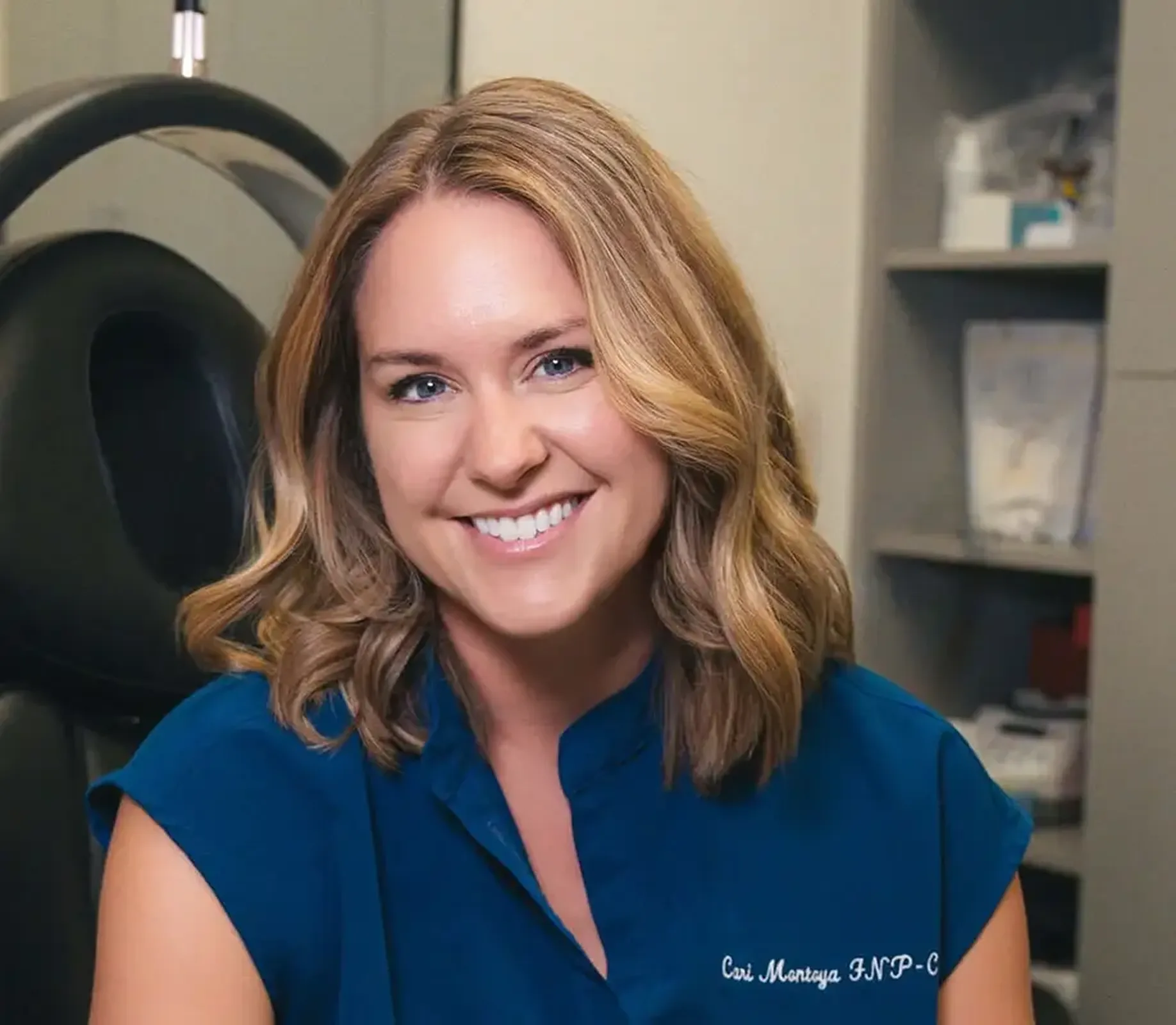 A woman standing in a room with green walls.