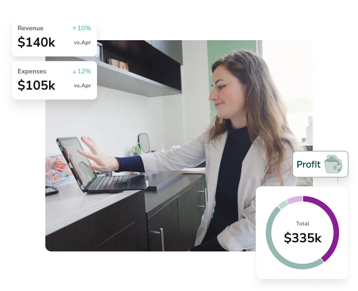 A woman sitting at a desk using a laptop computer.