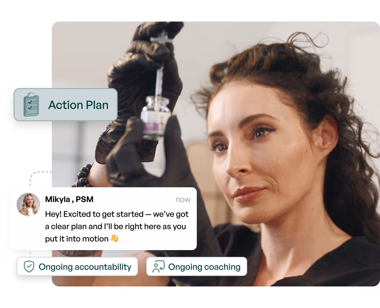 A woman sitting at a desk using a laptop computer.
