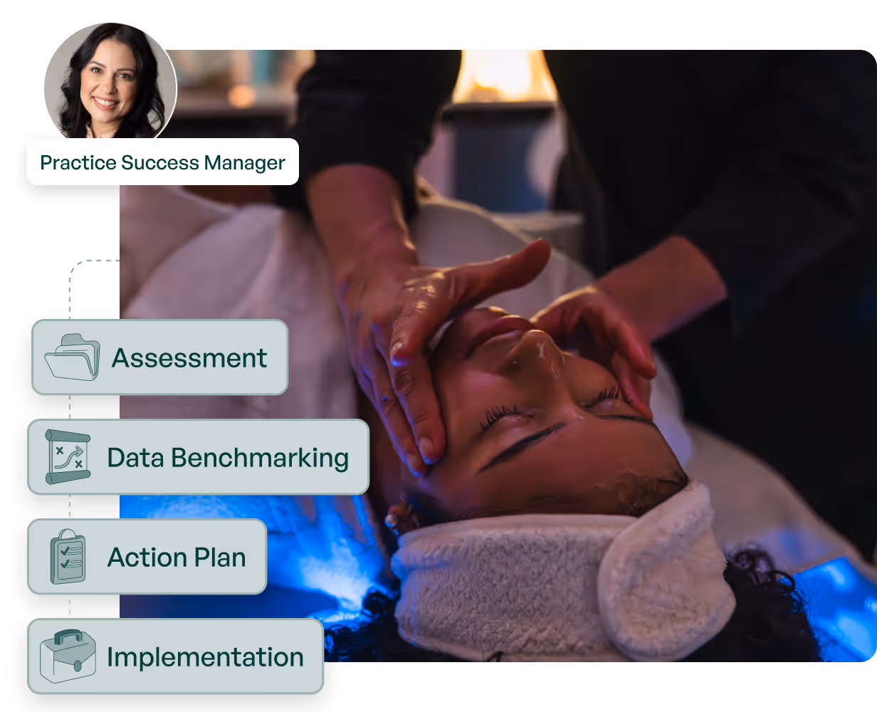 A woman sitting at a desk using a laptop computer.