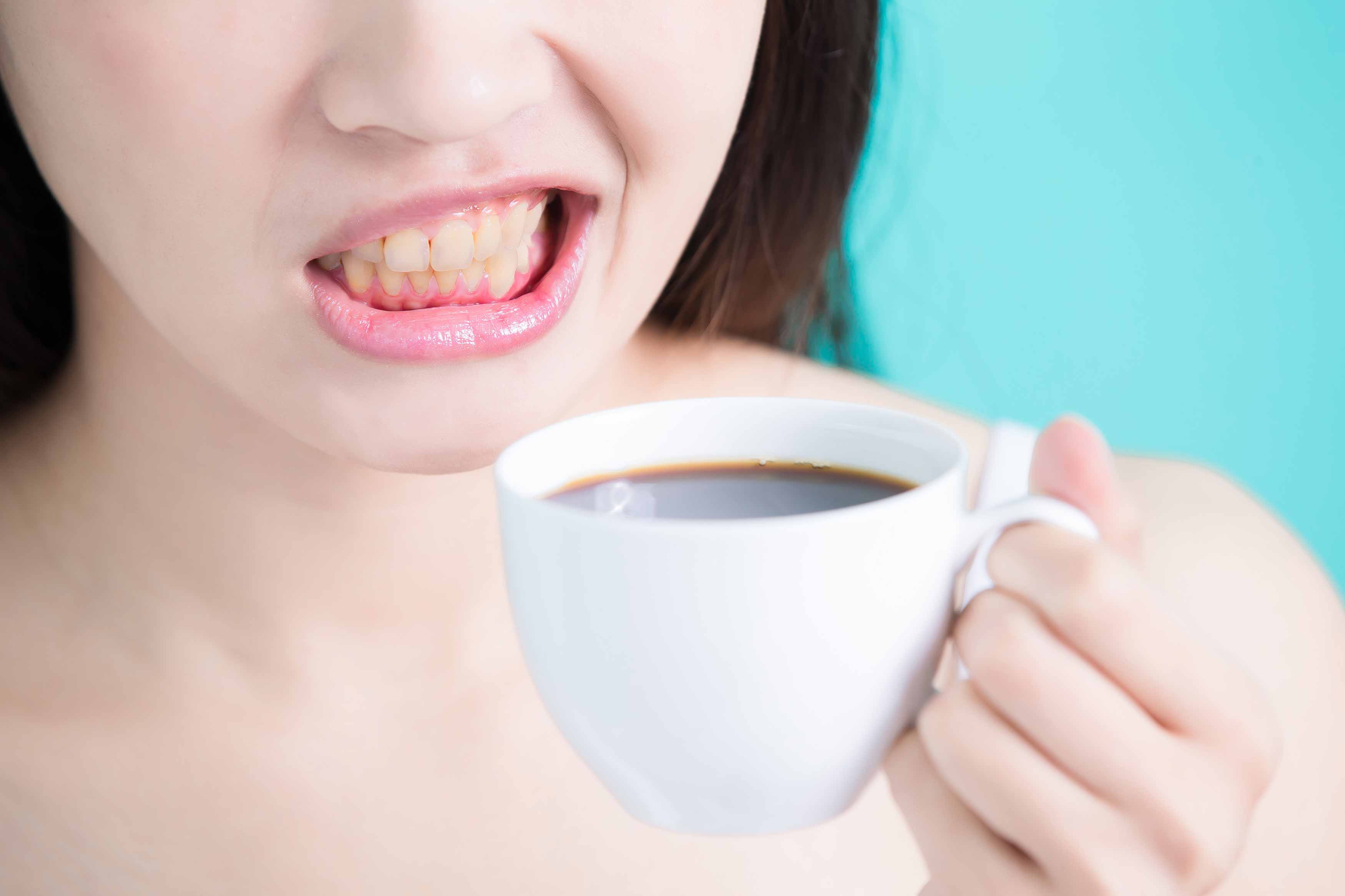 a photo of someone drinking a cup of coffee
