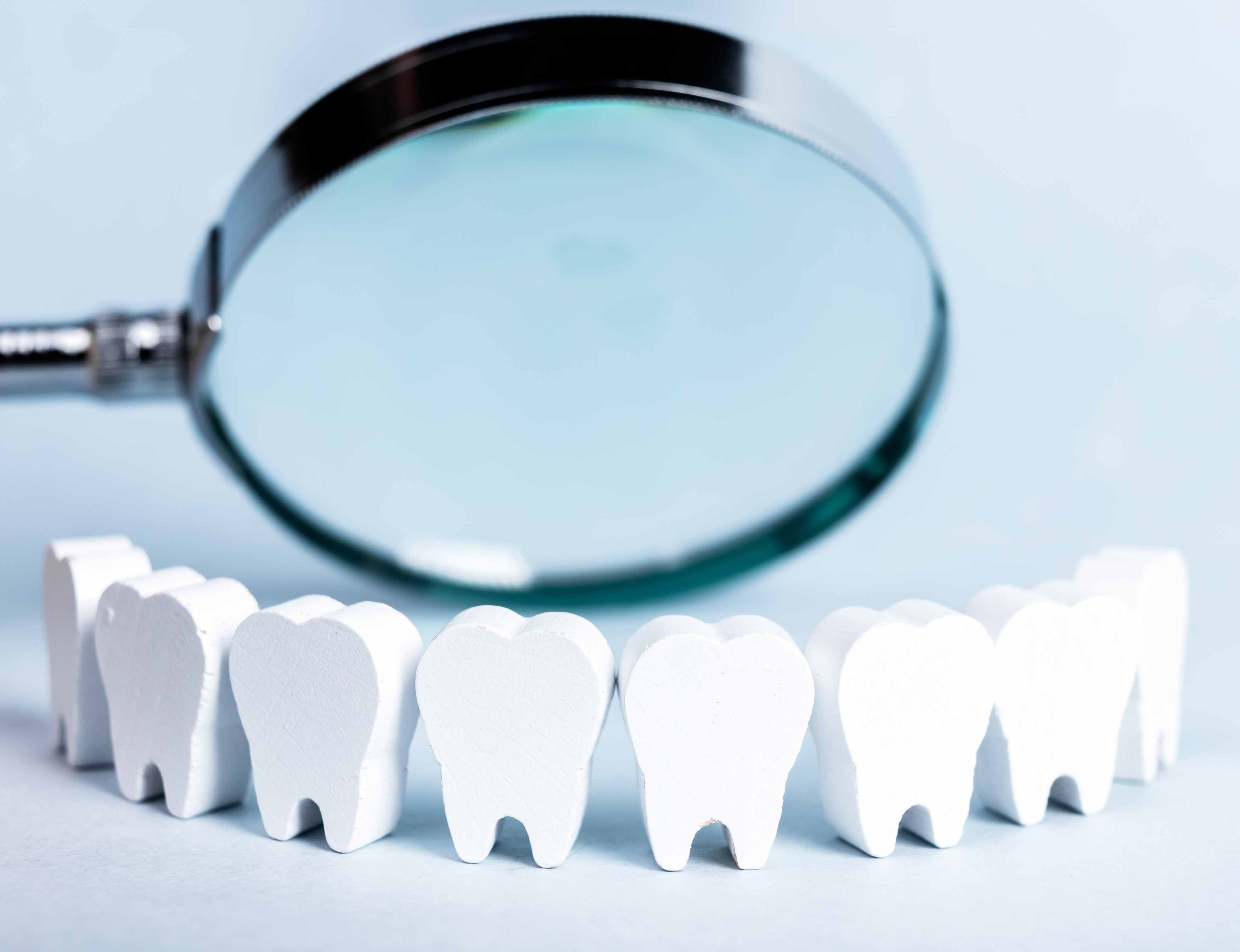 Upclose photo of someone's mouth showing part of their upper right central incisor missing