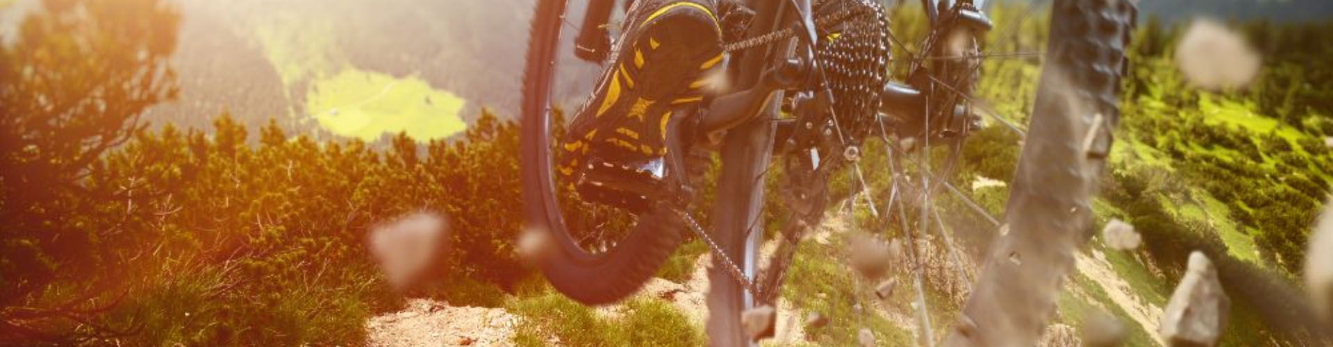 A mountain bike jumping over a rocky path