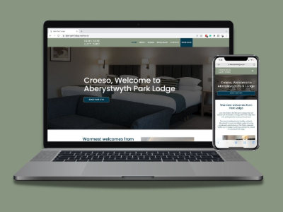 Laptop and mobile phone displaying Park Lodge Hotel Aberystwyth's new website