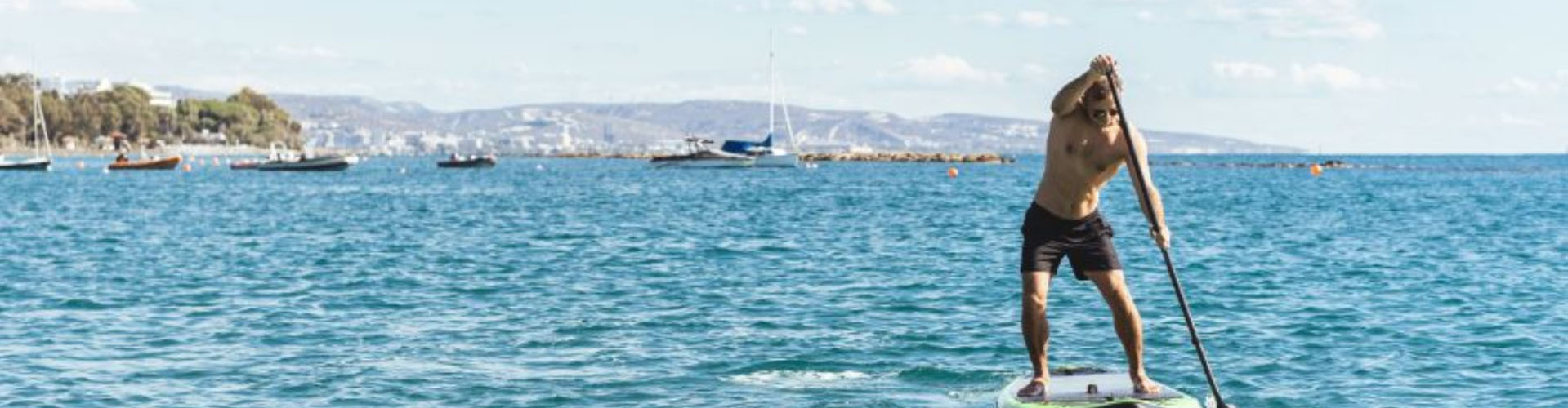 Man paddleboarding on the sea