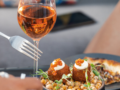 Diners sharing food at a restaurant table – places to eat in Aberystwyth