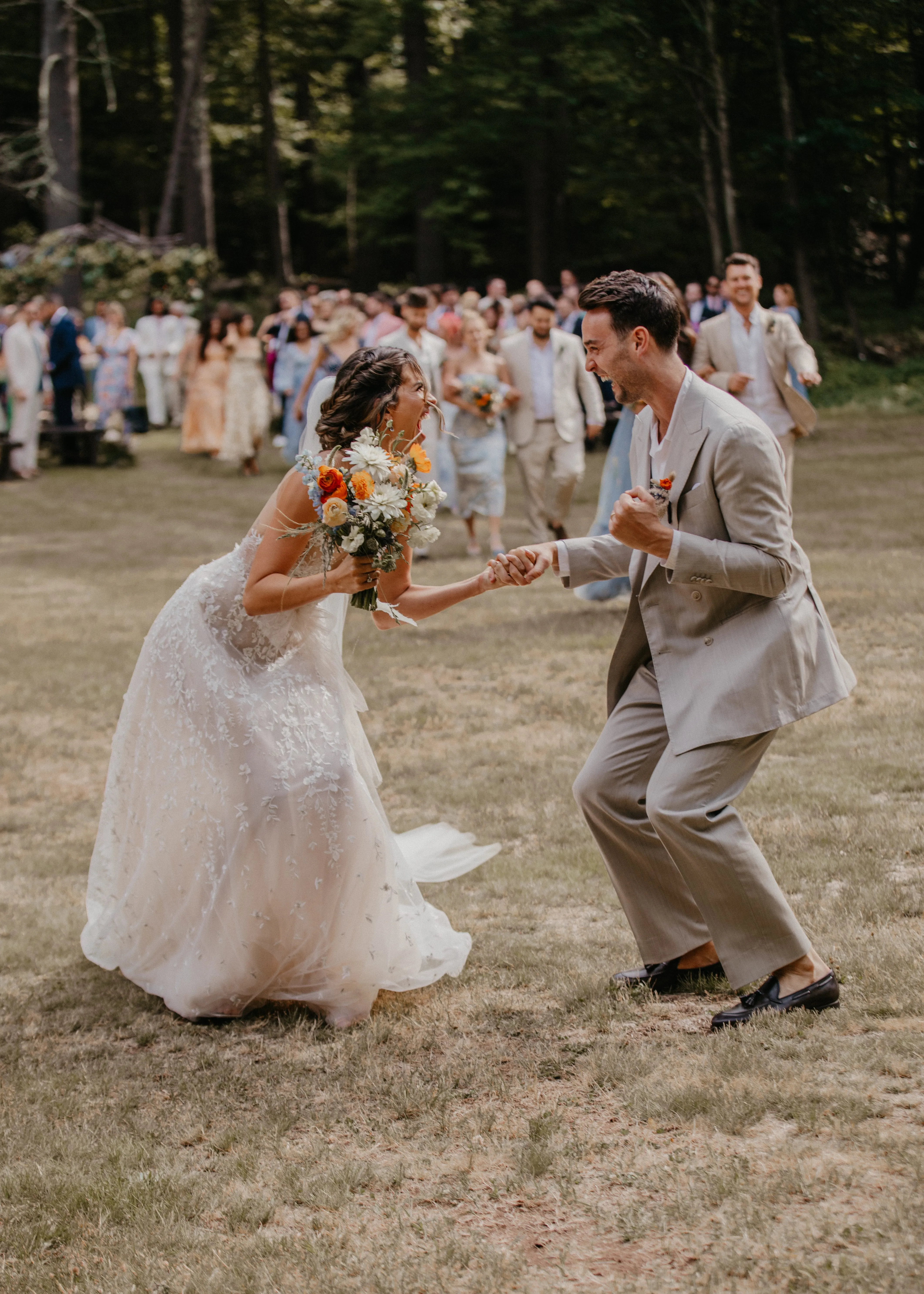 Bride and groom dancing together outdoors after their Glen Falls House ceremony