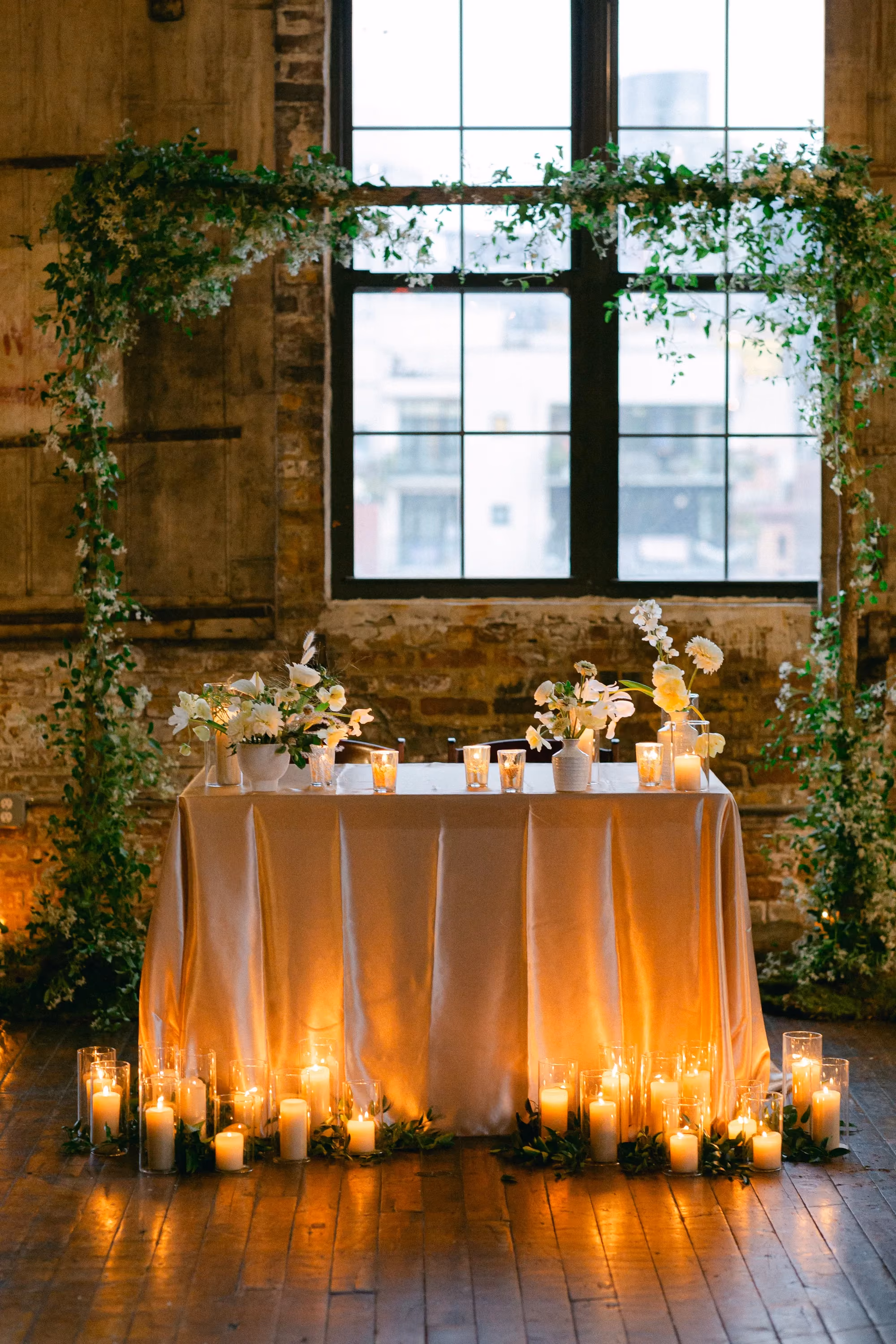 Greenpoint Loft Wedding Reception, sweetheart table with candles and flowers
