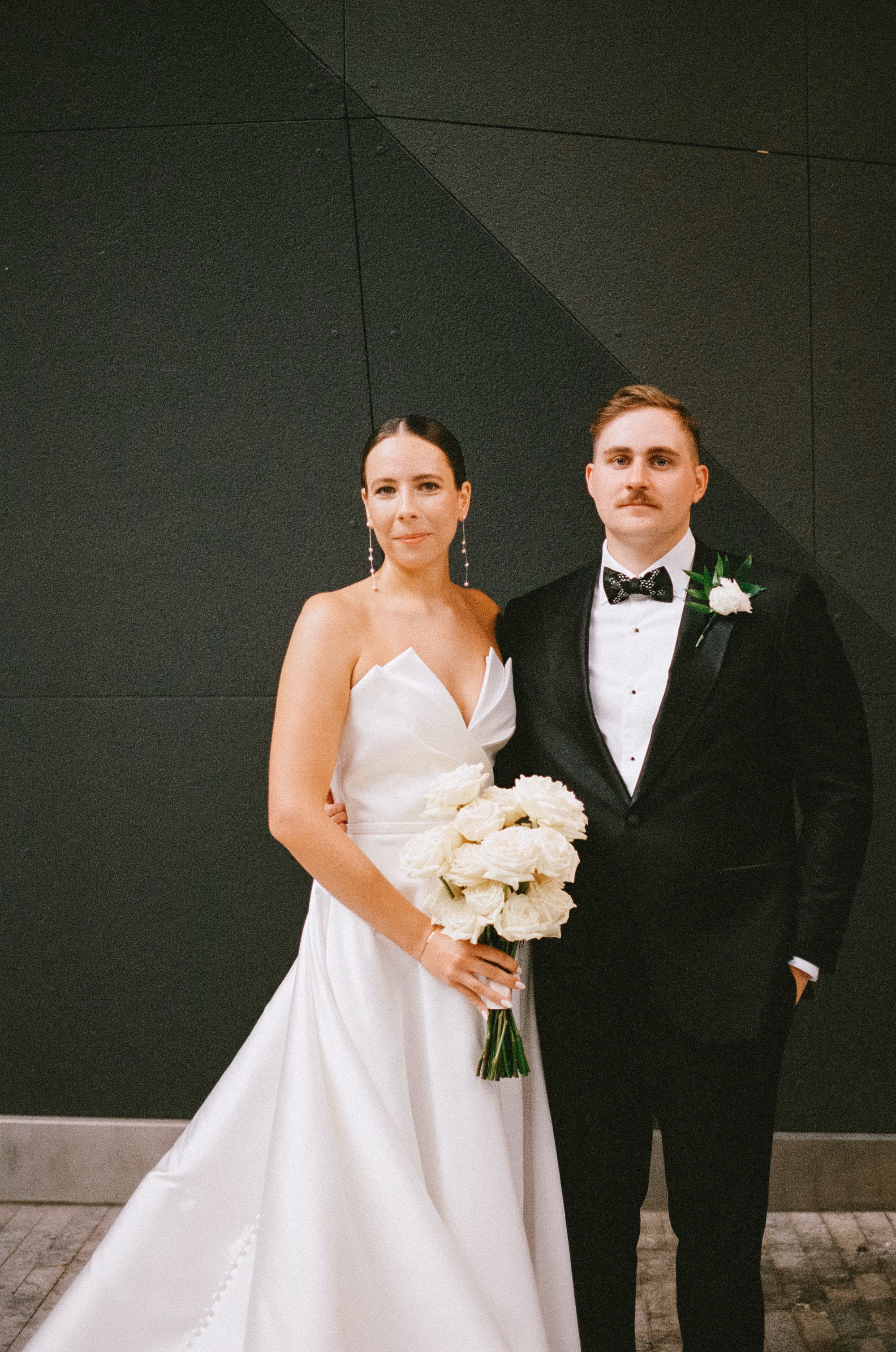 Bride and groom at the Westlight, William Vale Hotel with a white rose bridal bouquet