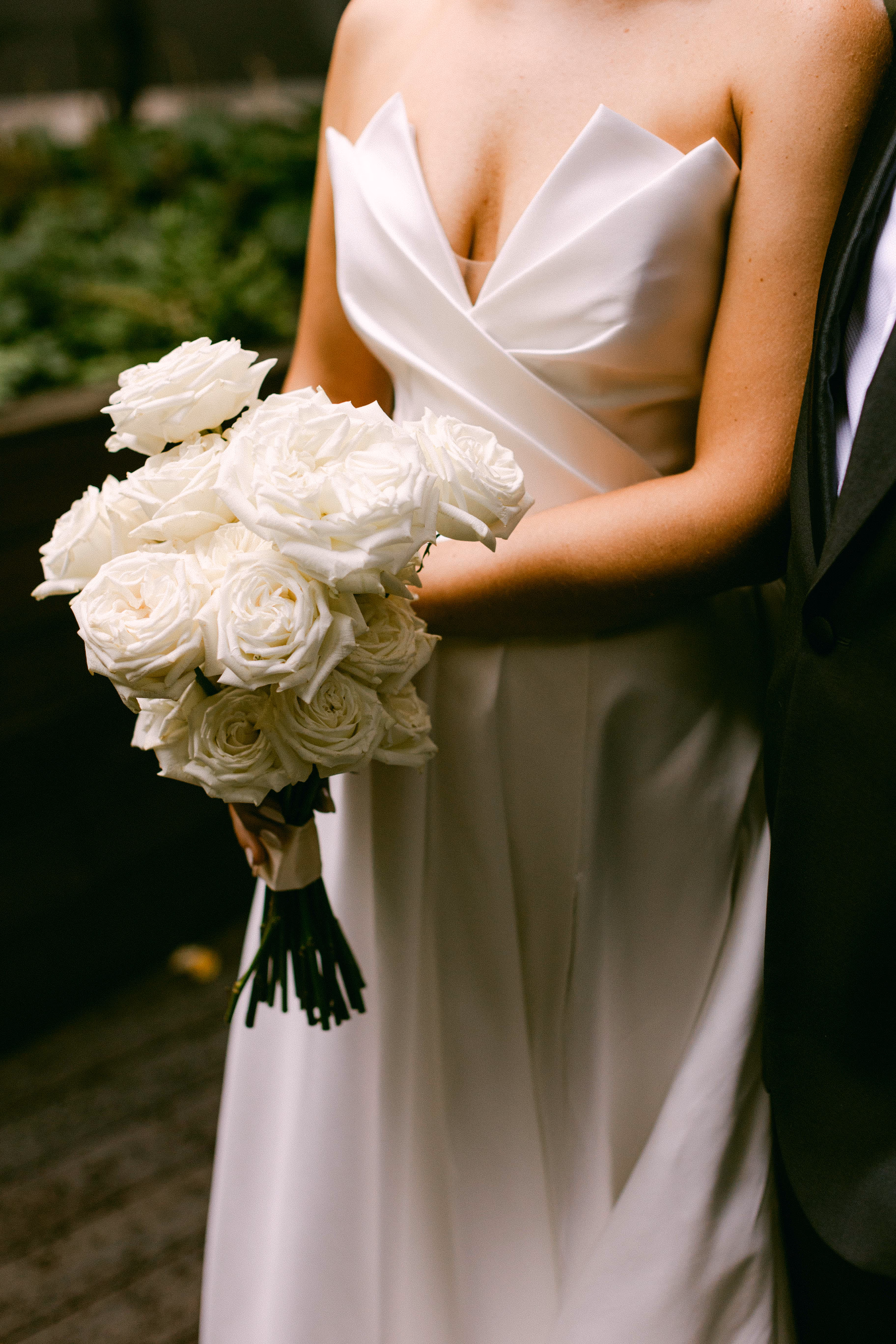 A long stemmed white rose bridal bouquet 