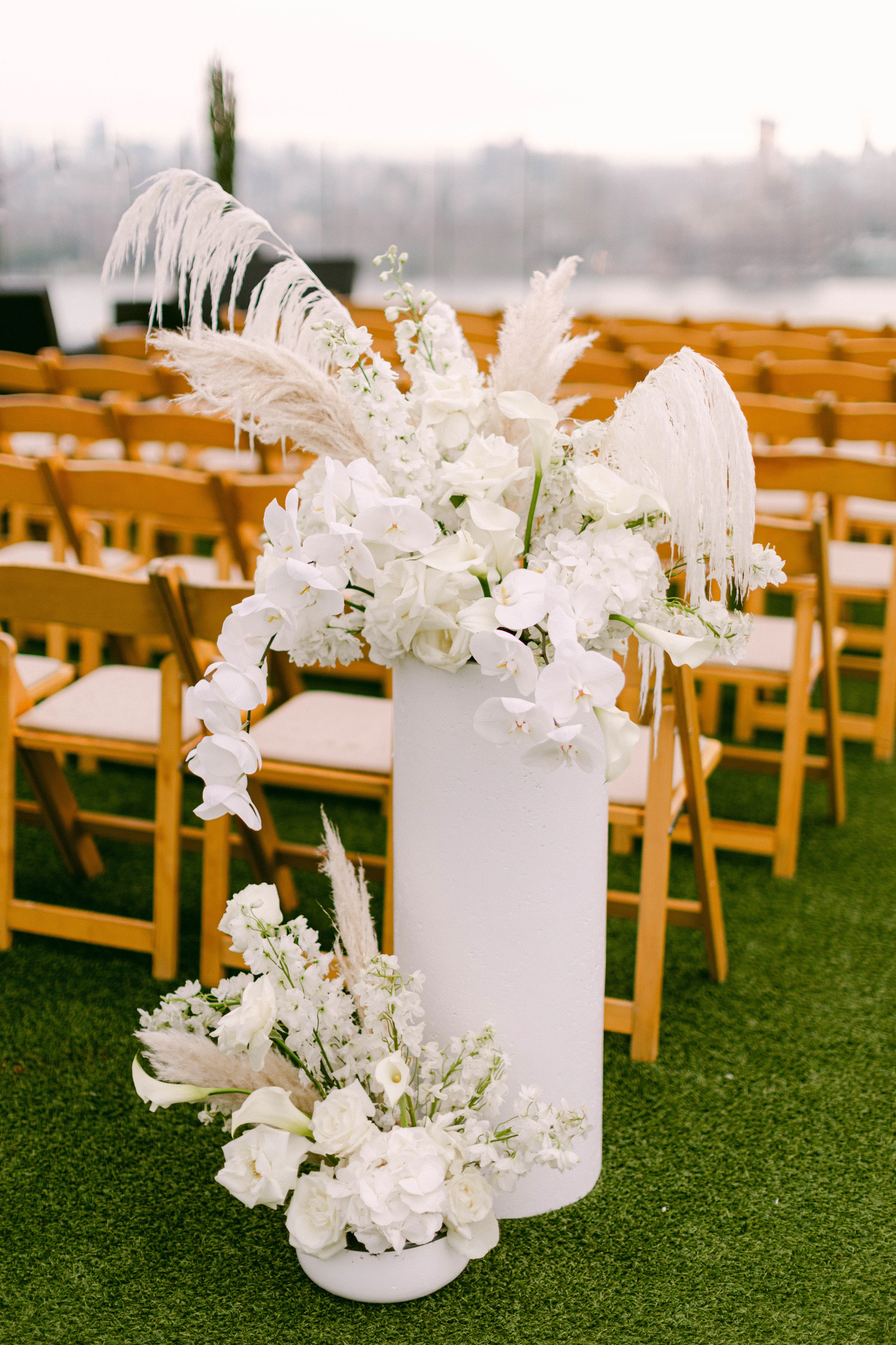 Head of aisle flowers at a rooftop wedding ceremony at Westlight, William Vale Hotel. 