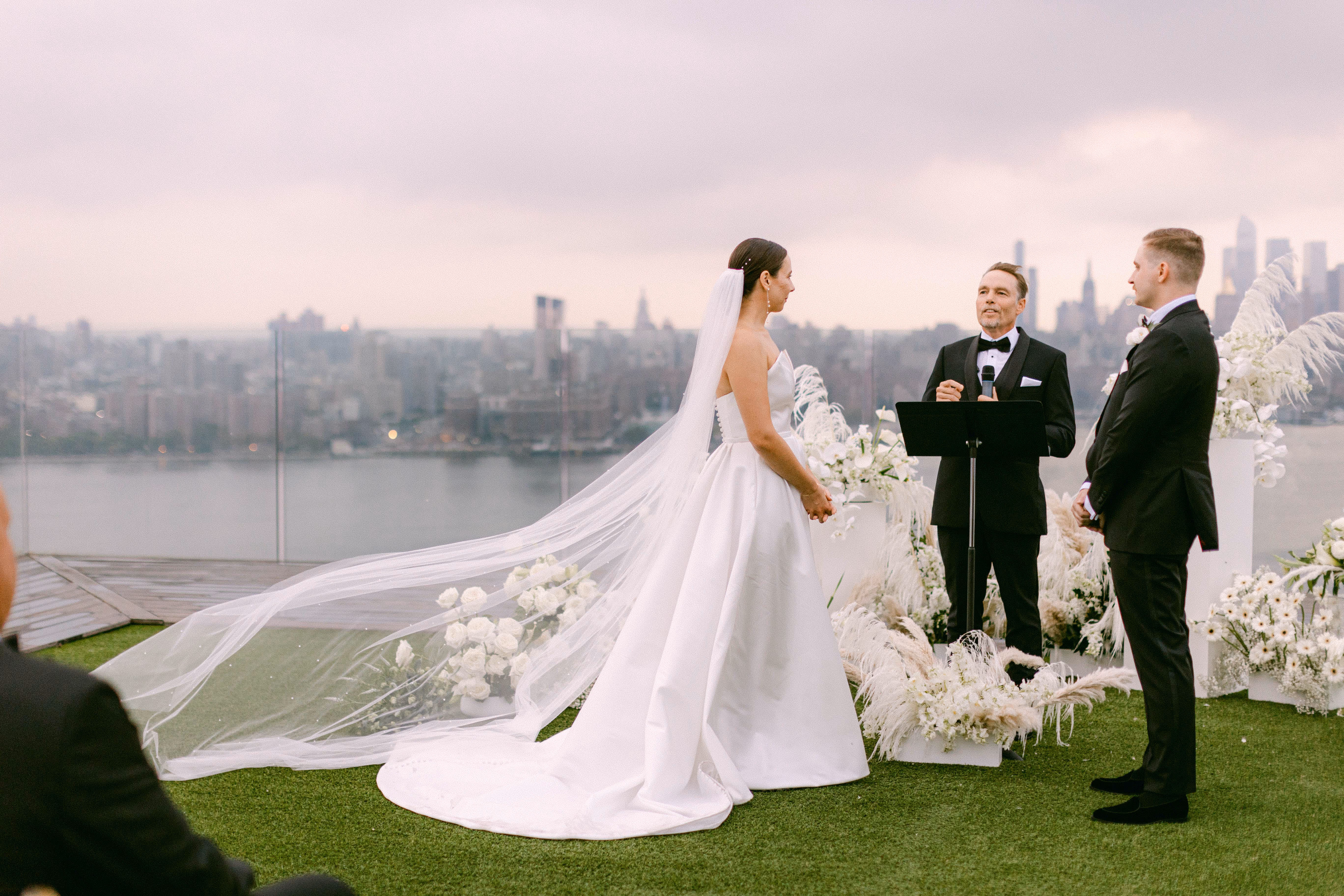 Rooftop wedding ceremony at Westlight, William Vale Hotel with white flowers