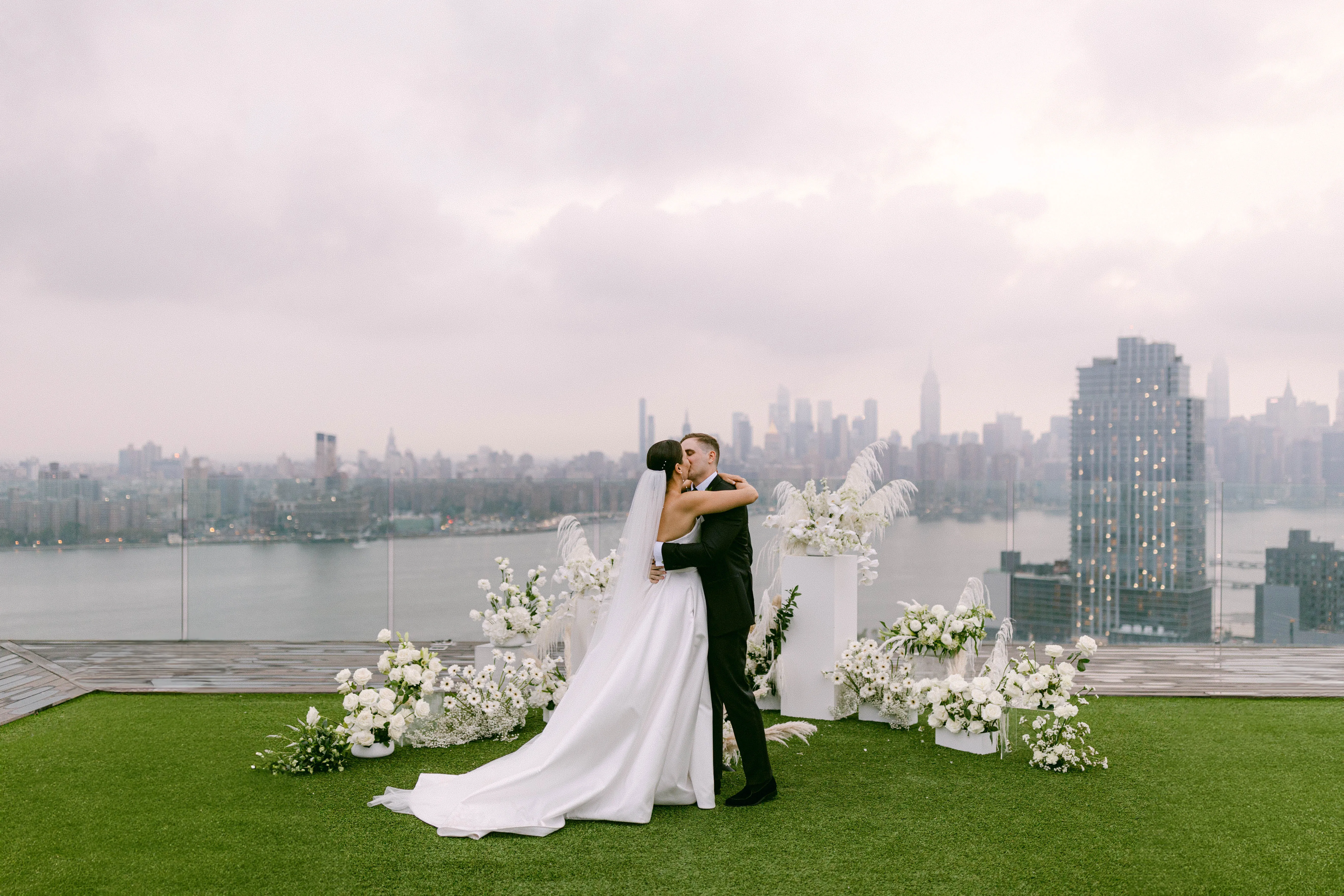 Rooftop wedding ceremony at Westlight, William Vale Hotel with white flowers