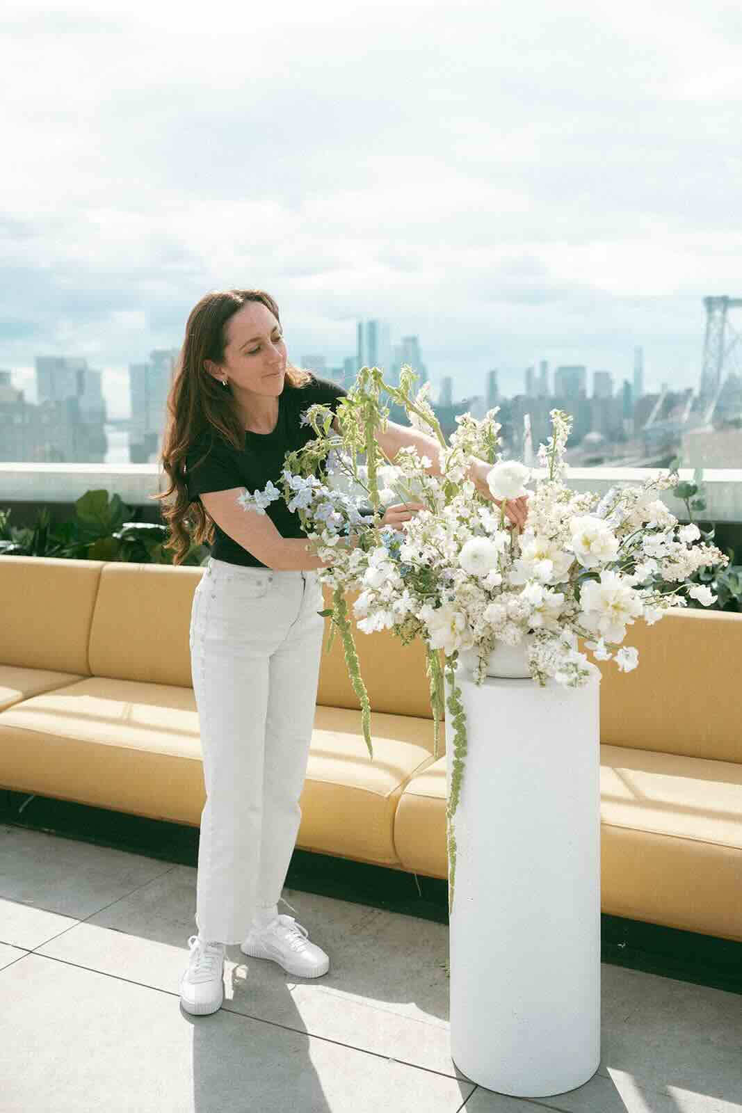 A florist working on ceremony flowers