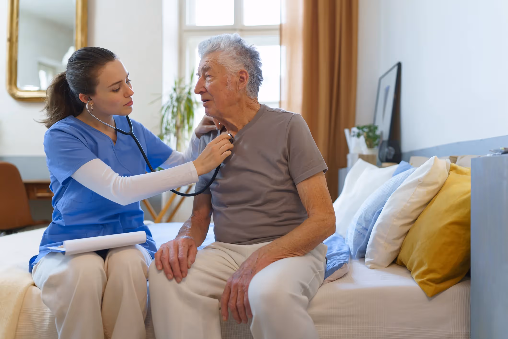A nurse listening for mesothelioma in an elder patient who might need a San Francisco Mesothelioma lawyer.