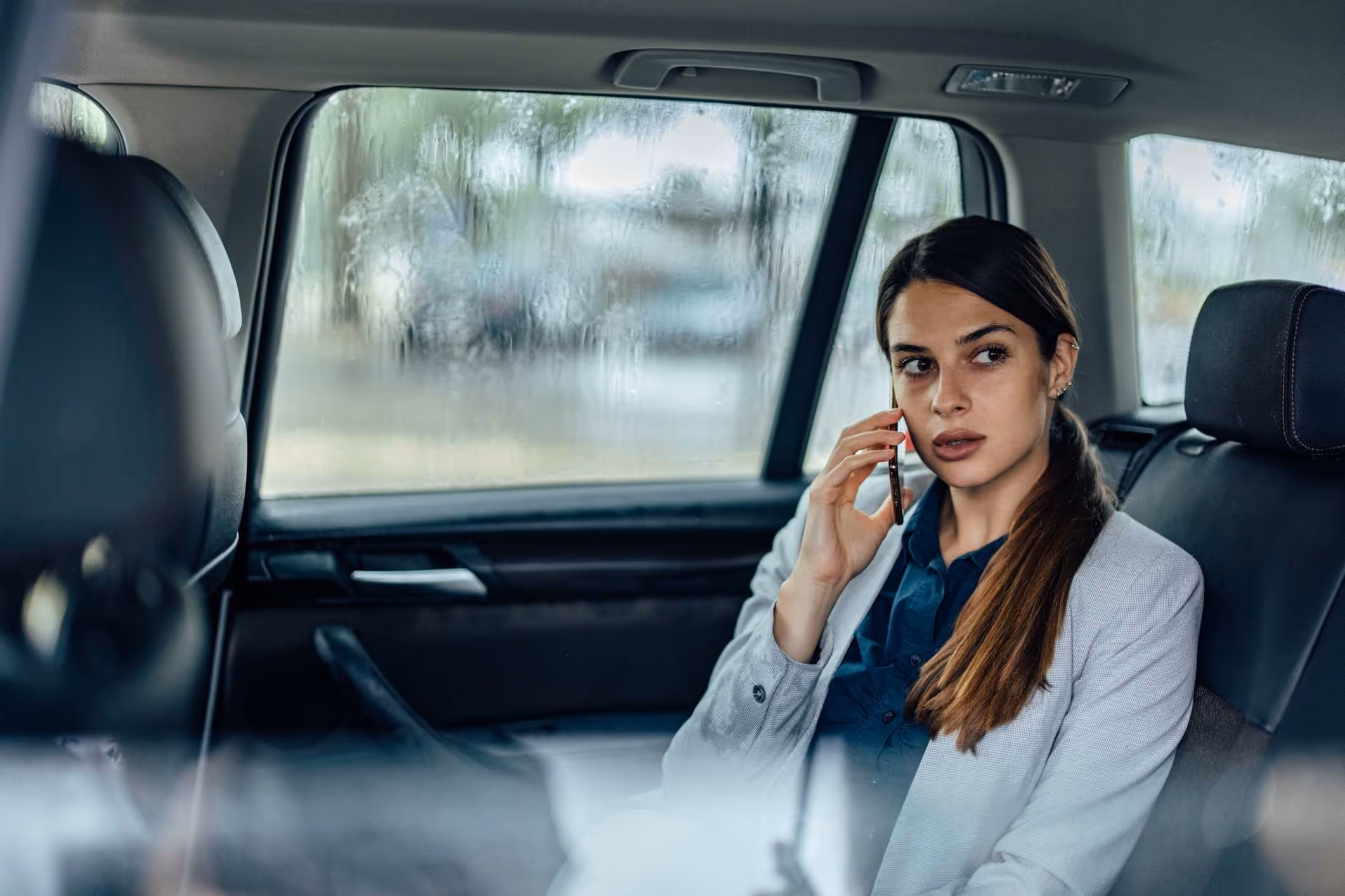 A passenger in an Uber, illustrating the importance of a Chicago Uber sexual assault lawyer for support.