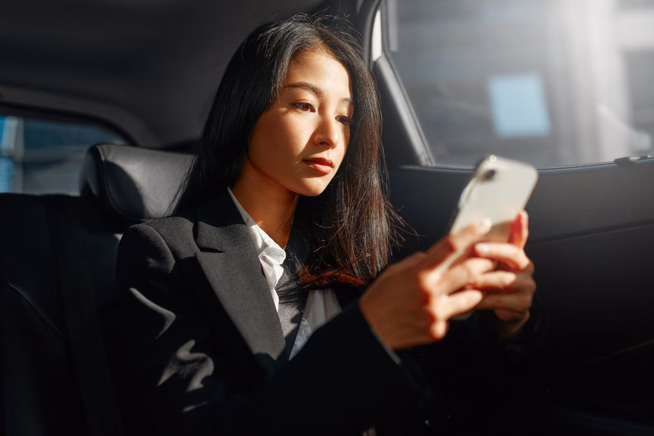 A woman in an Uber, representing the need for a Portland Uber sexual assault attorney to protect your rights.