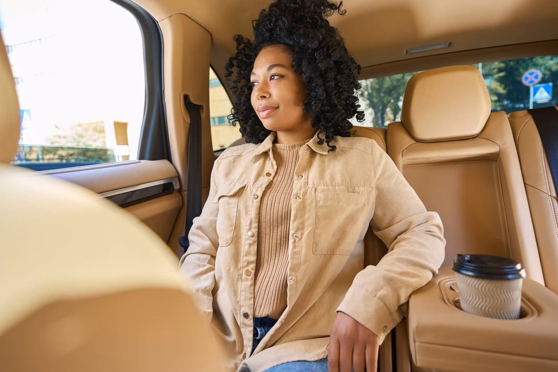 Passenger seated in back of car looking out window, representing Philadelphia Uber sexual assault attorney.