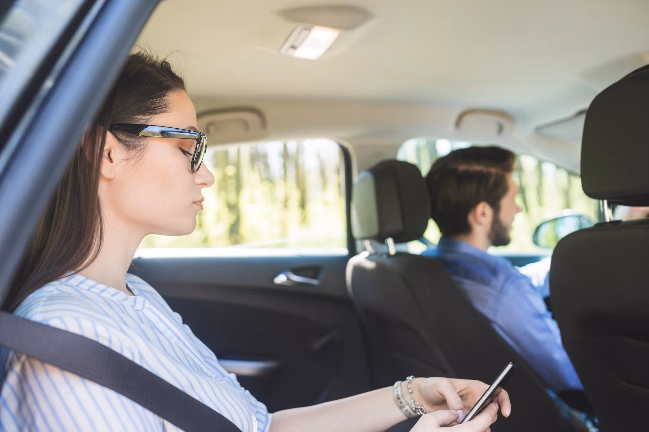 Woman a rideshare at night, representing support from a Dallas Uber sexual assault attorney.