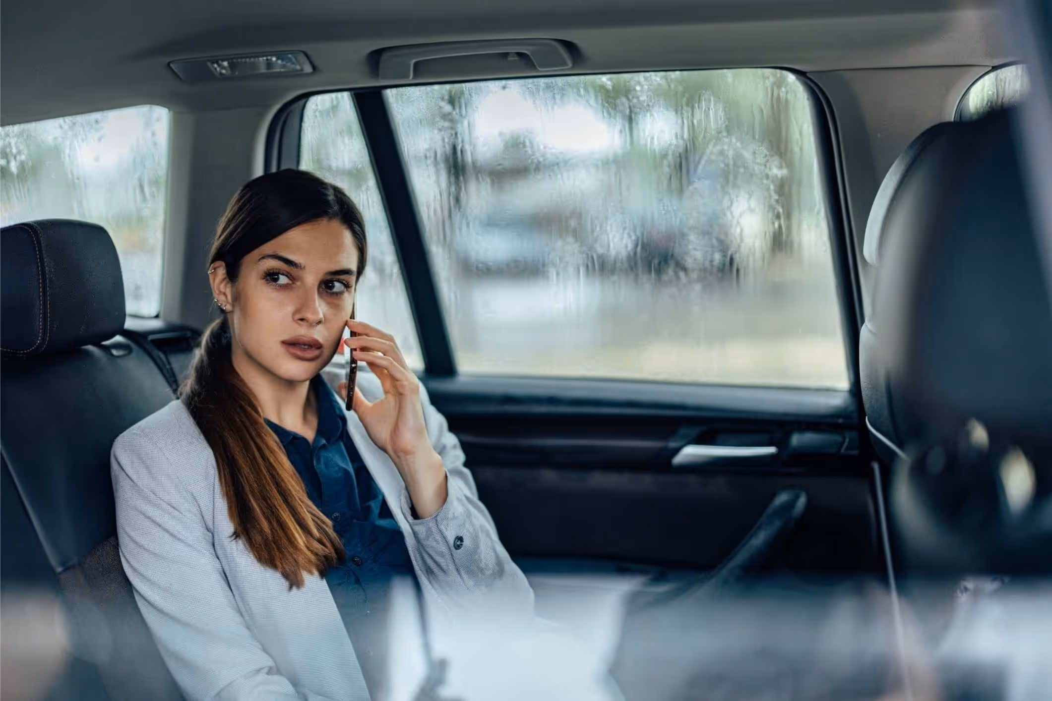 A passenger in an Uber, illustrating the importance of a Chicago Uber sexual assault lawyer for support.