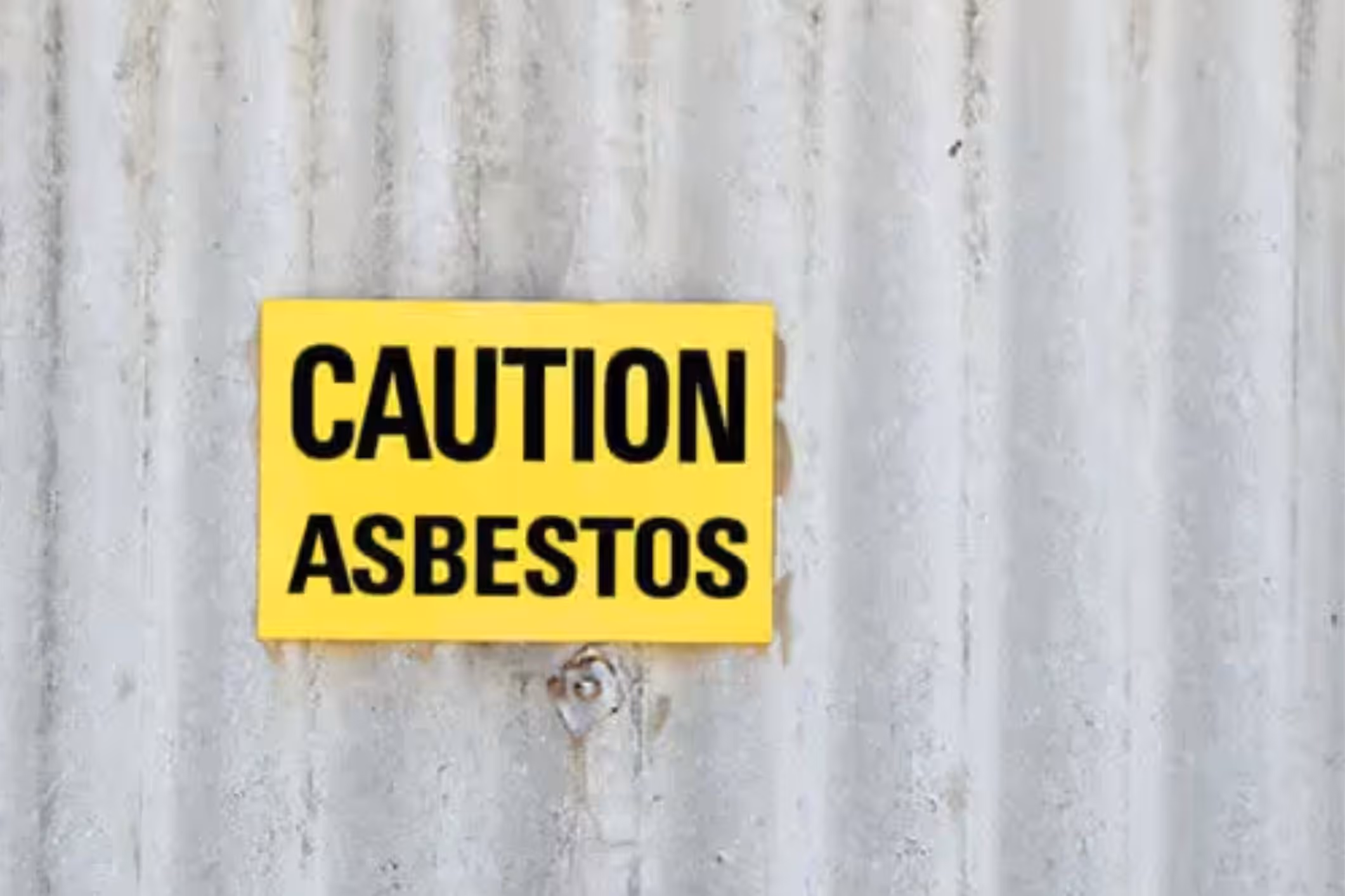 A caution sign for asbestos.