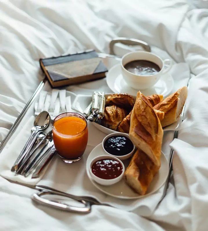 A traditional French breakfast composed of bread, jam, coffee and juice.