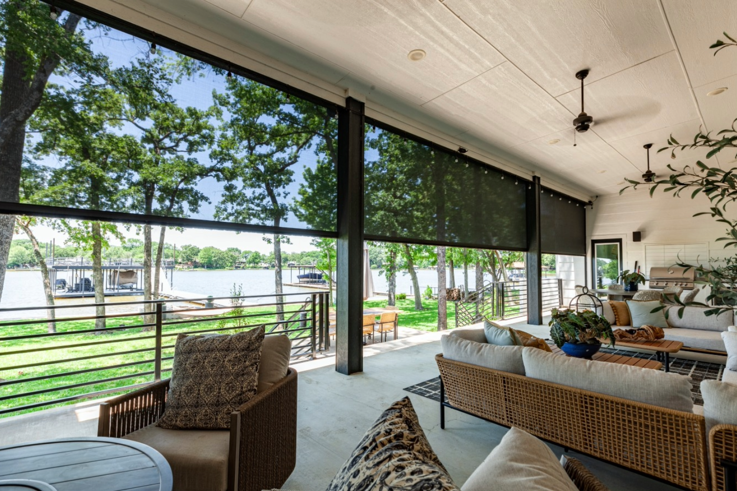 Outdoor patio with motorized shades, lakeside view in DFW.