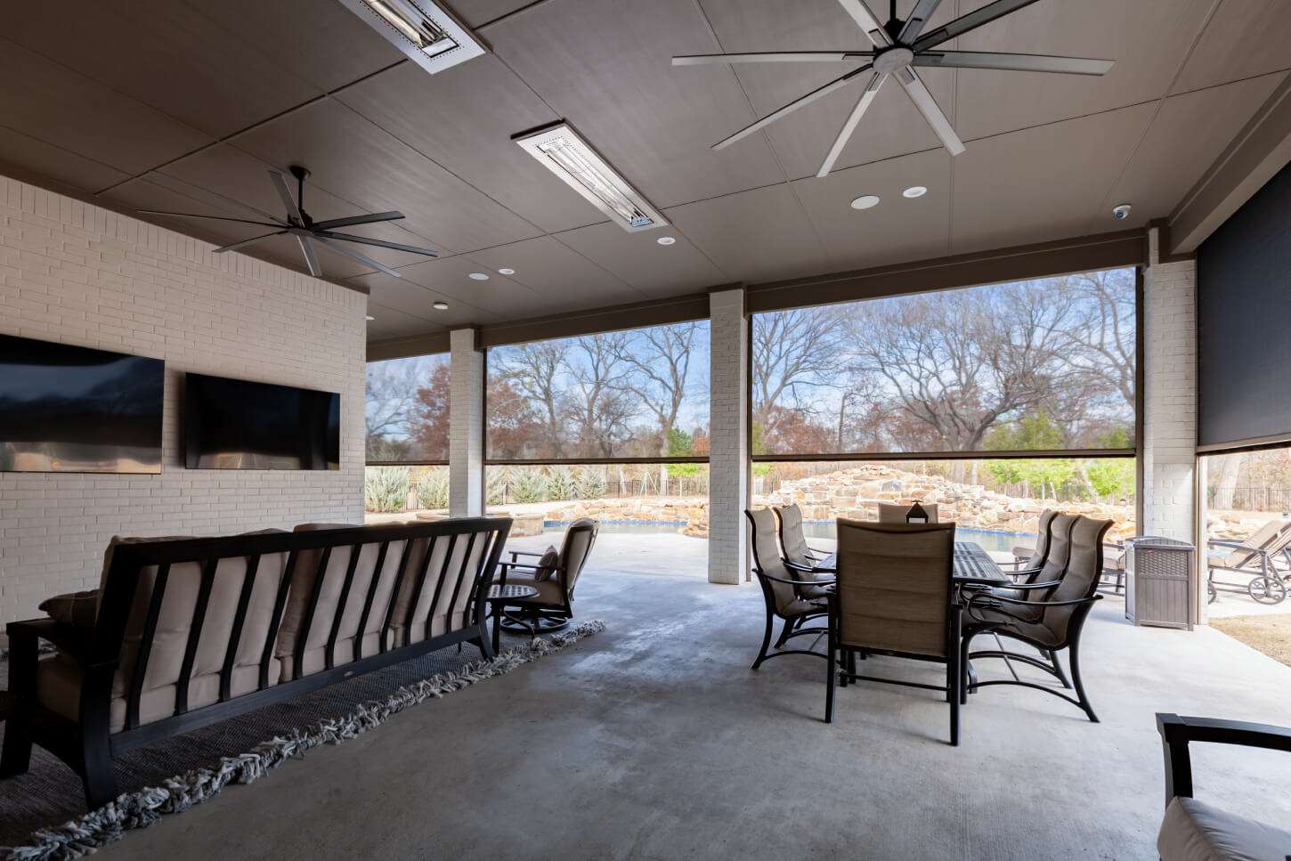 Covered patio with seating and outdoor shades