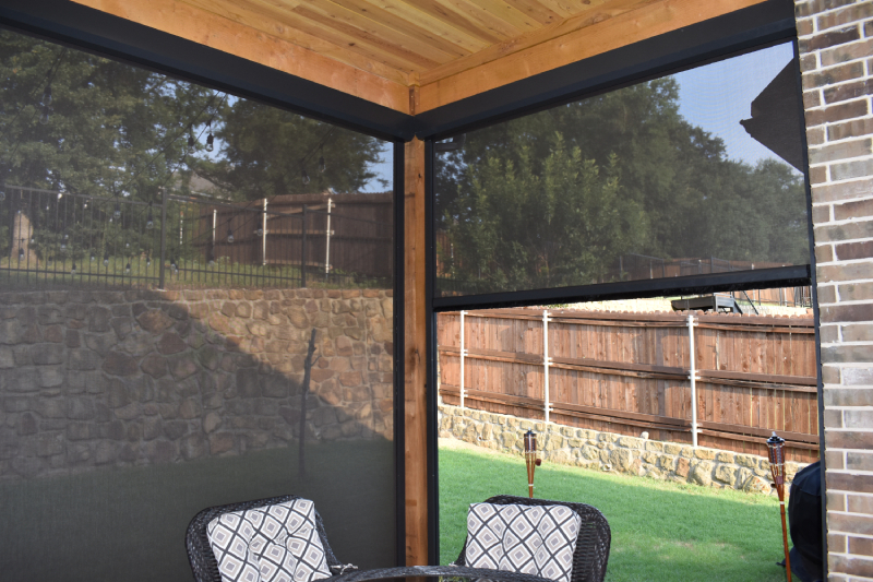 Outdoor patio with black mesh shades