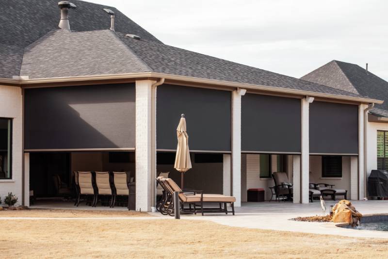 Patio with outdoor roller shades, Dallas-Fort Worth home.